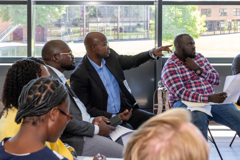 Man pointing to the front of a classroom during iCRA's Making Leadership Work course