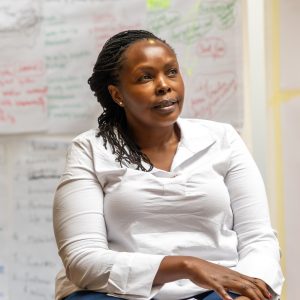 Irene Njogu smiling in a professional portrait