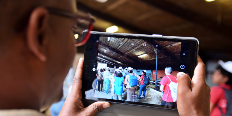 Mobile phone displaying agribusiness education resources, showcasing online training materials at iCRA expert bite 023