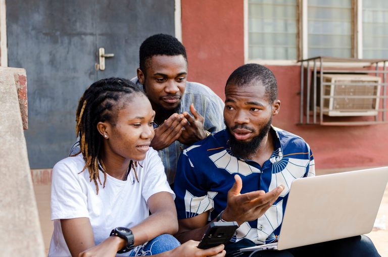 "Group of African college students studying together online