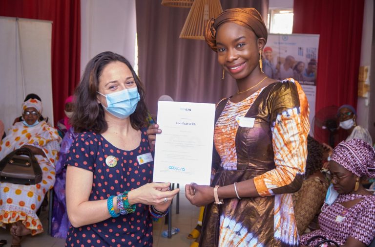 Malian women receiving a certificate from iCRA's trainer Myriam