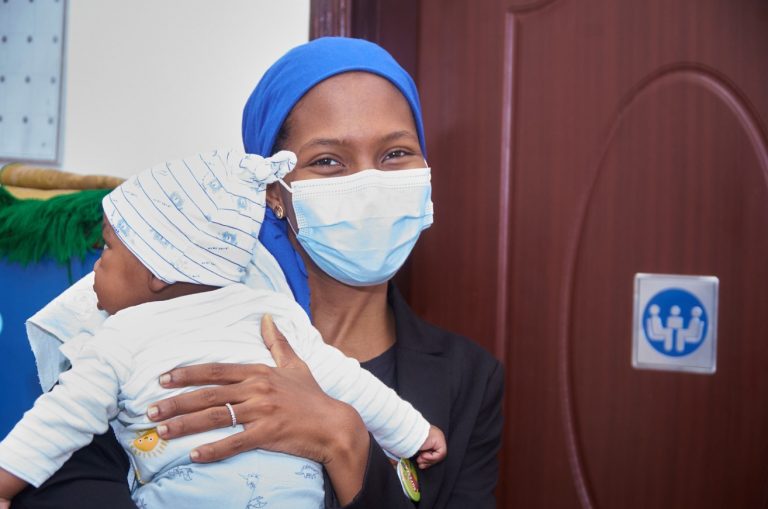 Malian participant attending training with her young child