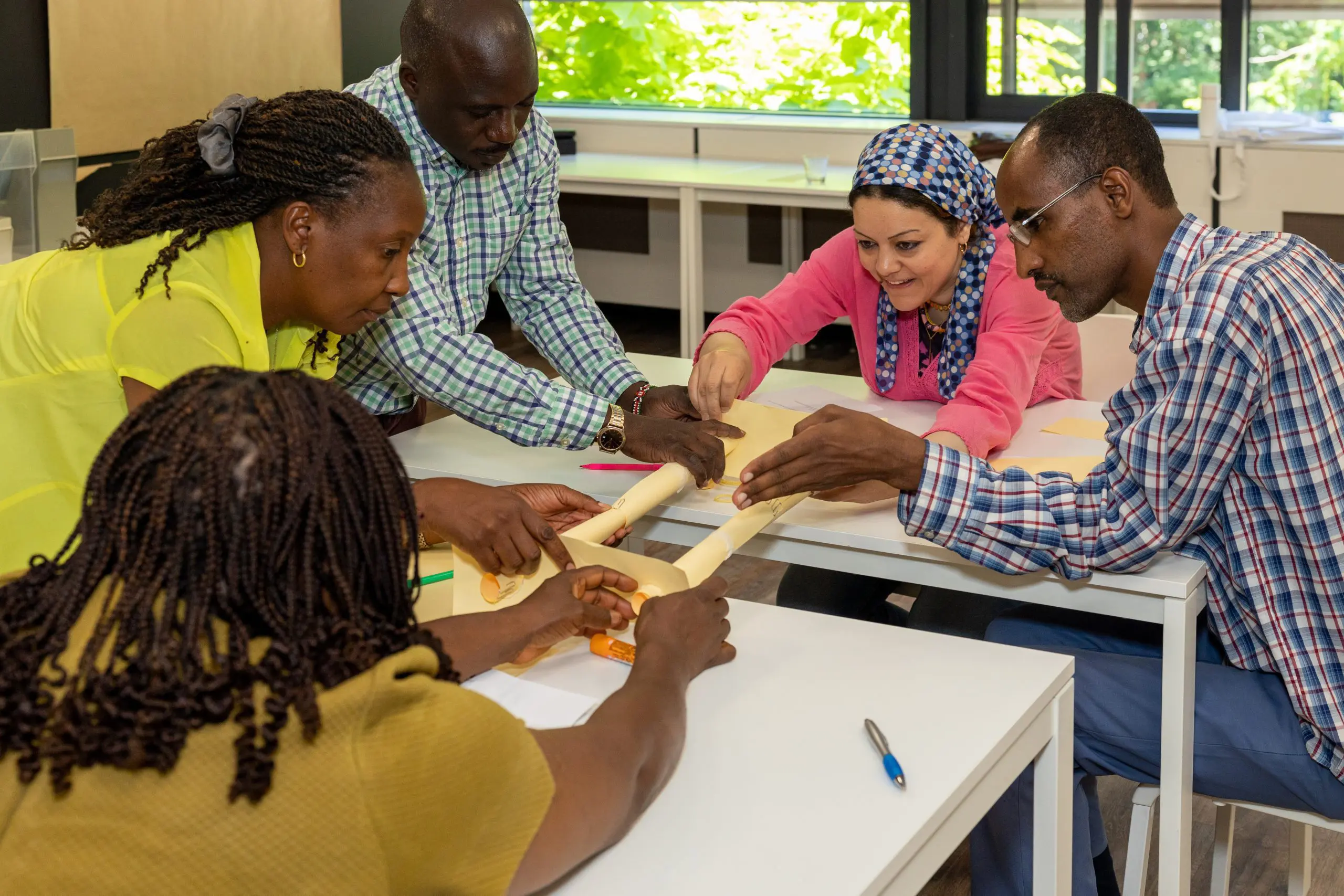 ICRA staff member is building bridges at iCRA, and participating in a meeting to bridge cultural differences and improve communication in expert bite 021