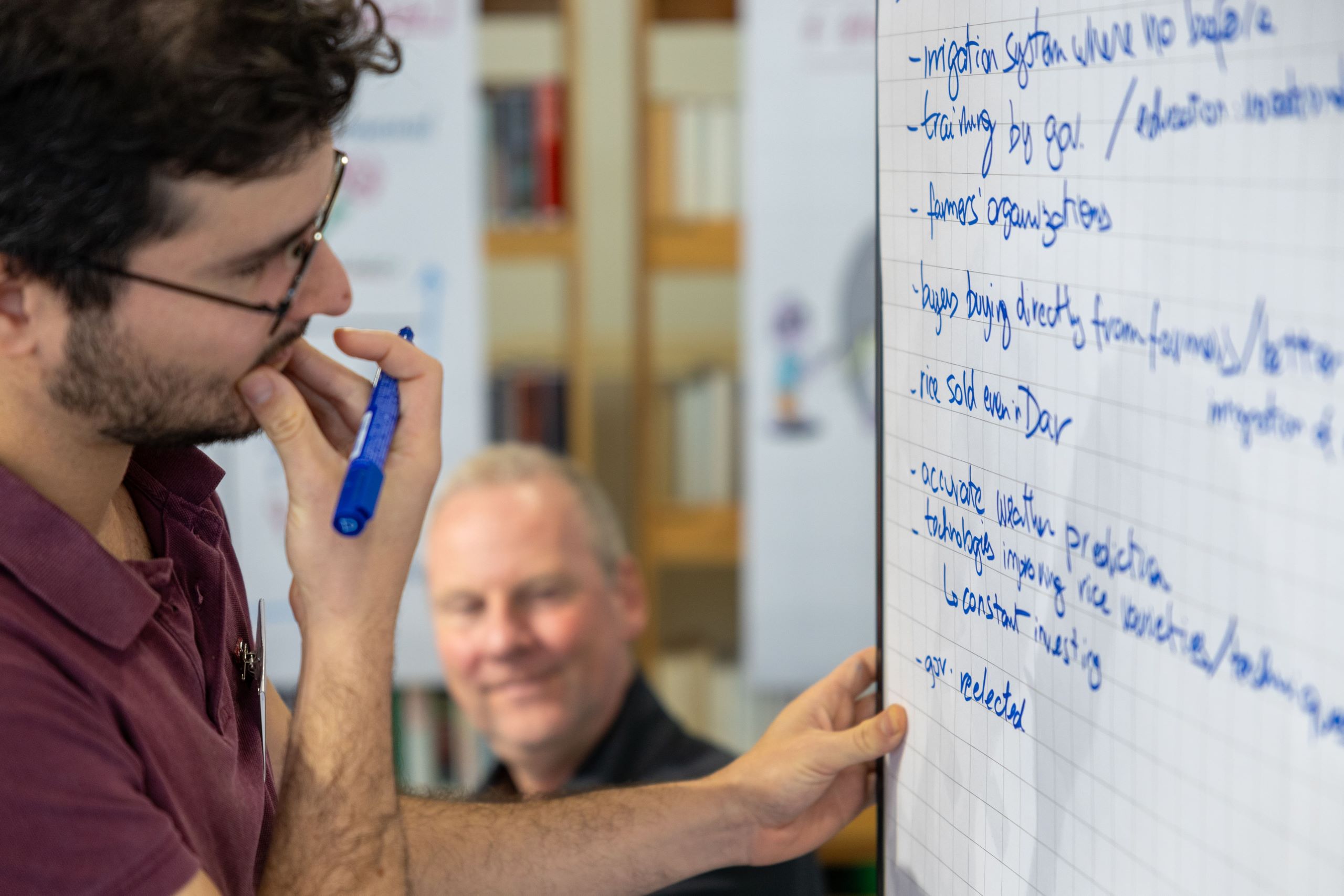 Man writing on flipchart